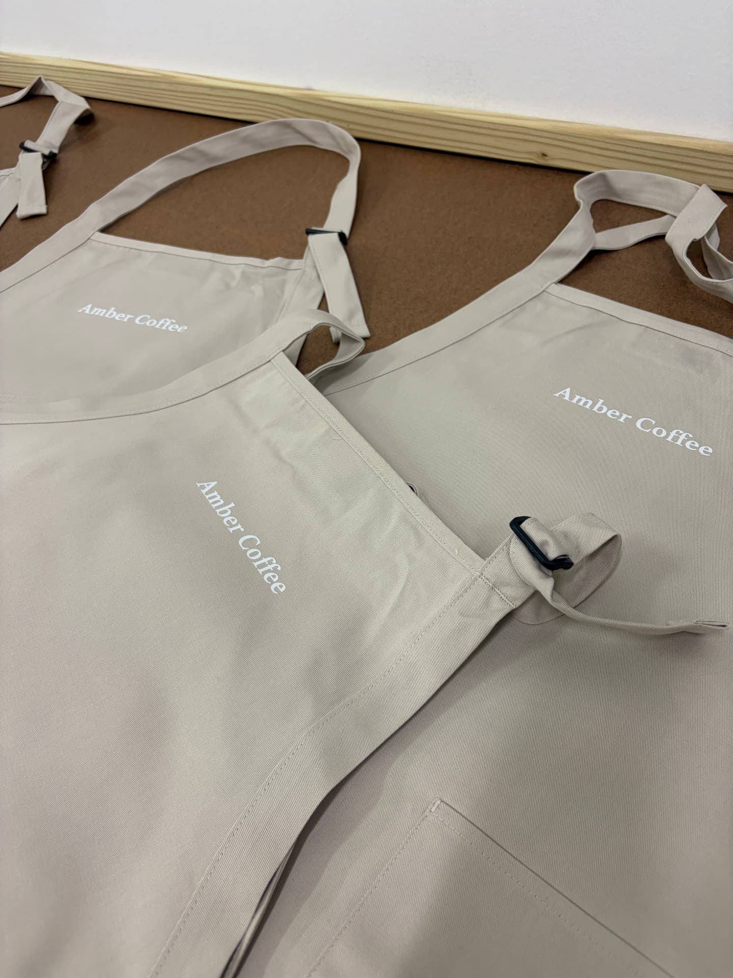 Custom printed aprons for a coffee shop by Dava X