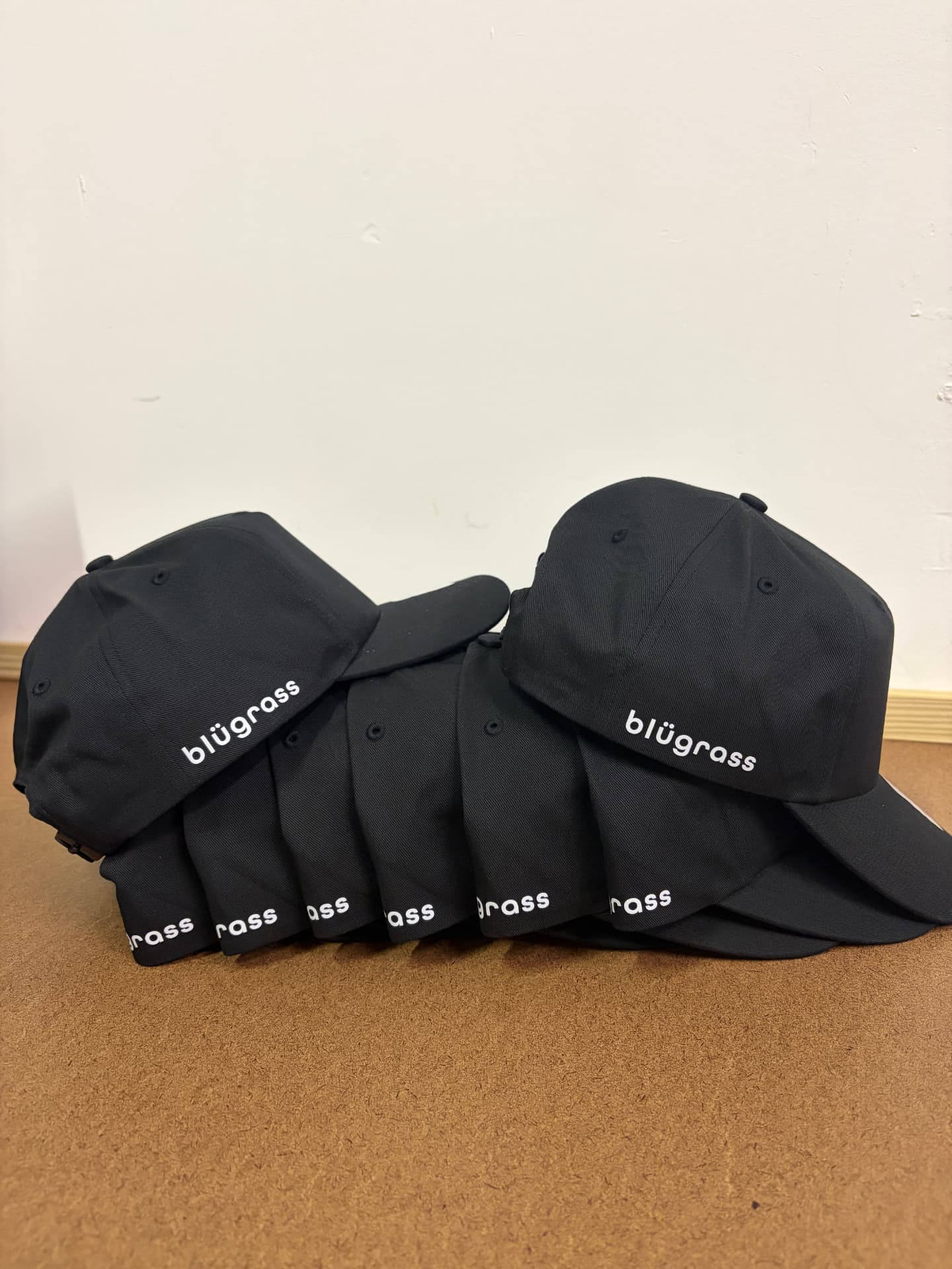 Custom embroidered black caps by Dava X
